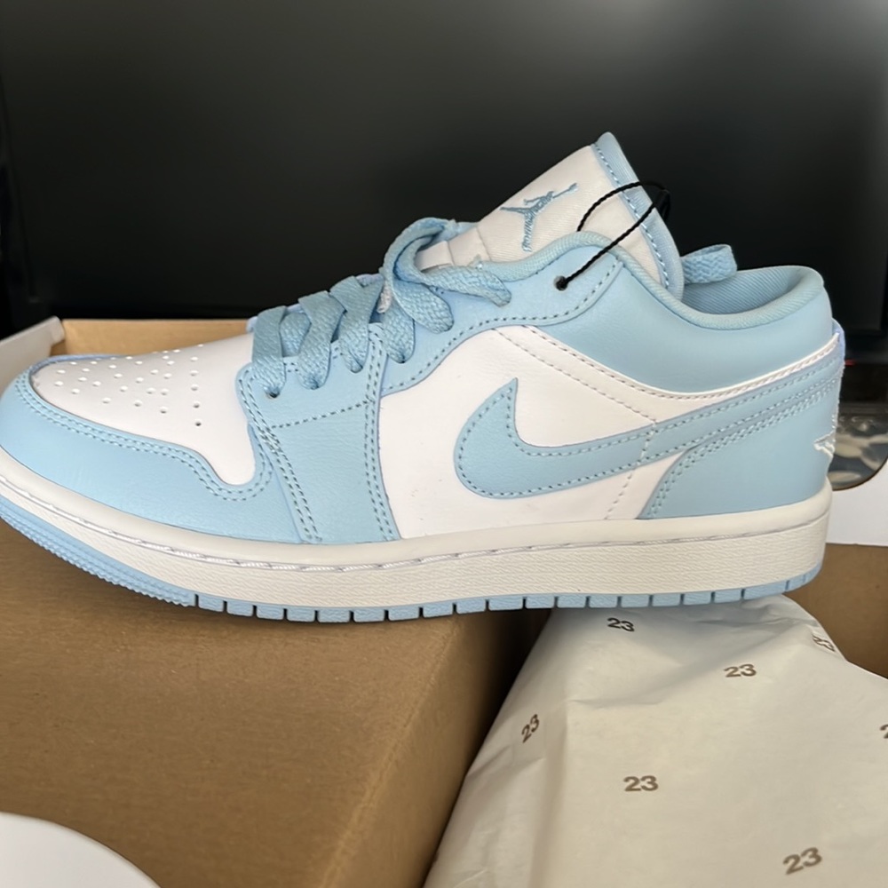 Brand new Nike women’s air jordan 1 low in white/ice blue. Size 6